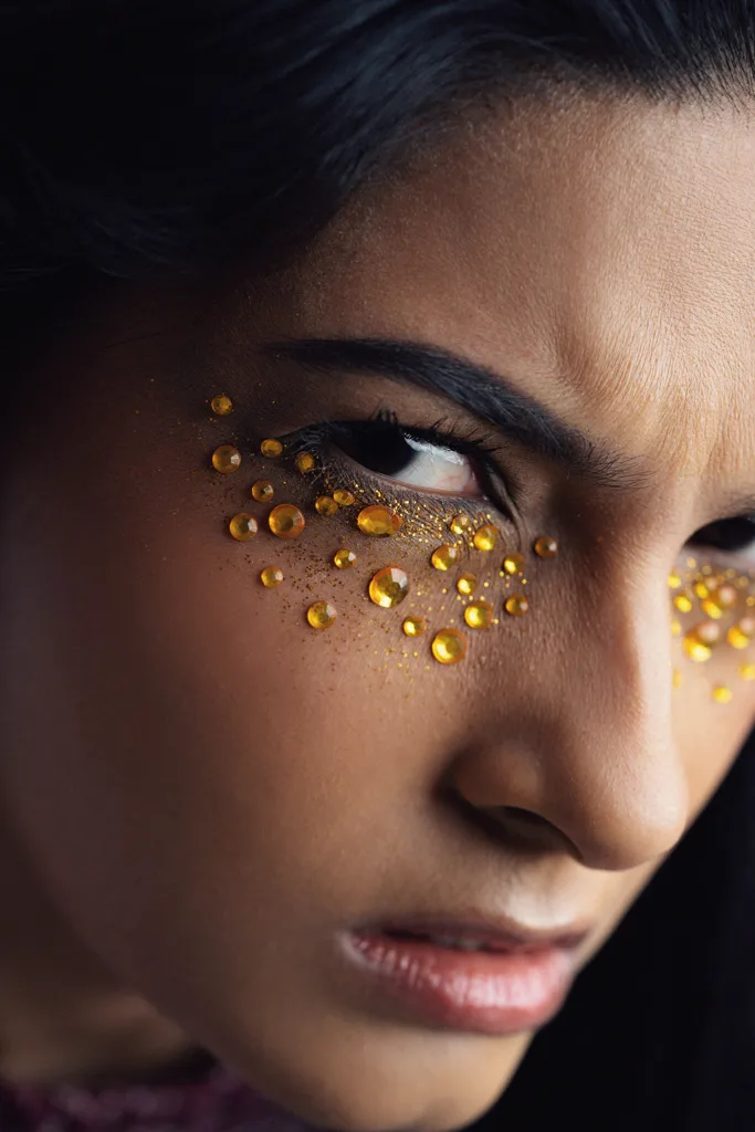 Beauty editorial with gold leaf freckles, photographed by Shreyak Singh