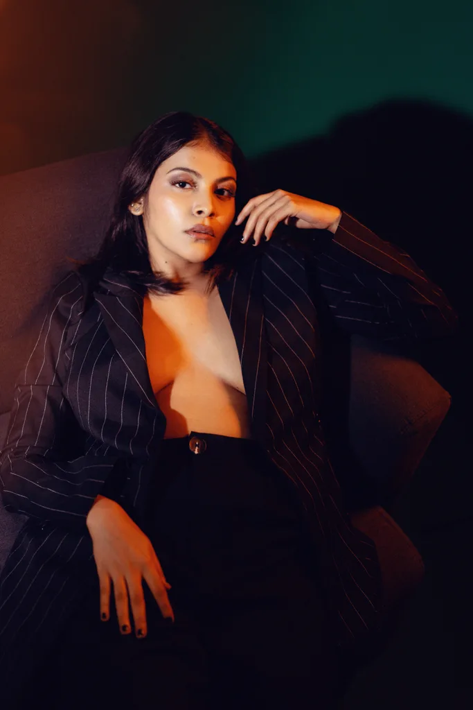 Studio fashion portrait lit in orange and blue, photographed by Shreyak Singh