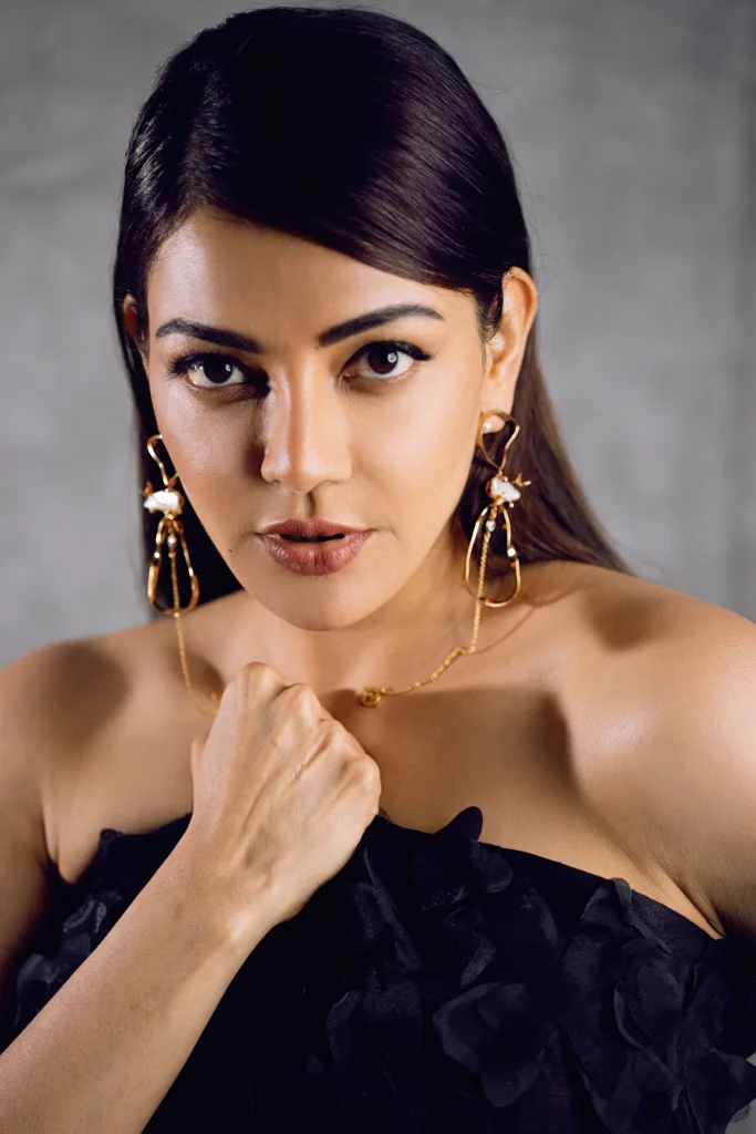 Fashion portrait in a black ruffled top with gold earrings, photographed by Shreyak Singh