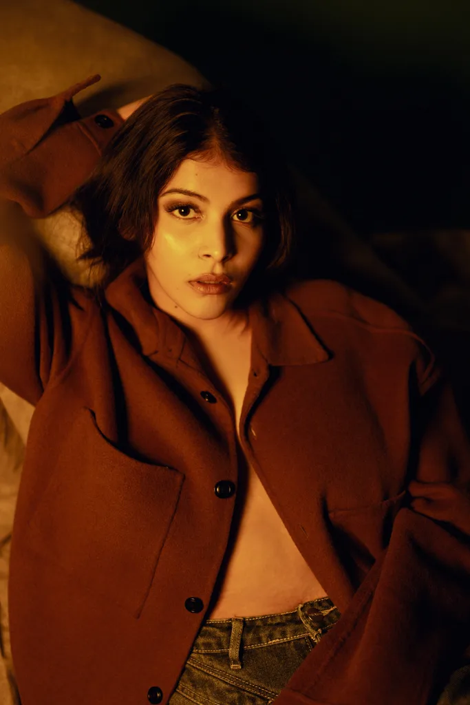 Fashion portrait in a brown jacket with warm light, photographed by Shreyak Singh