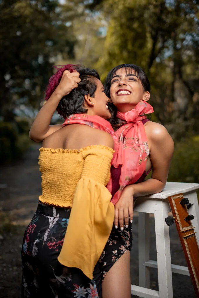 Outdoor fashion photograph, two models in a yellow and pink look, photographed by Shreyak Singh